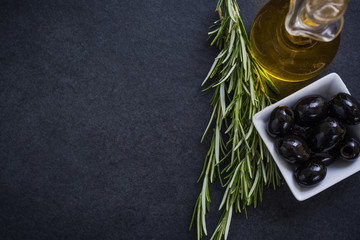 olive oil with olives and herbs