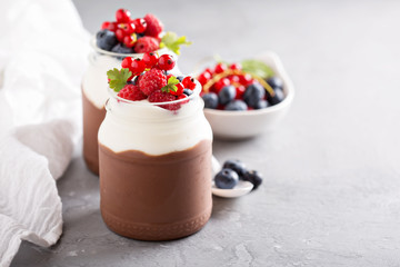 Chocolate pudding with cream and fresh berries