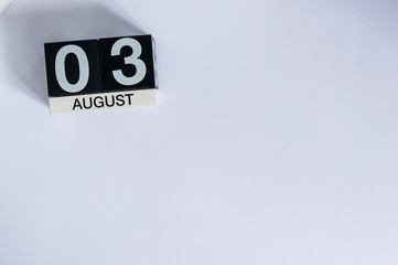 August 3rd. Day 3 of month, wooden color calendar on white background. Summer time. Empty space for text