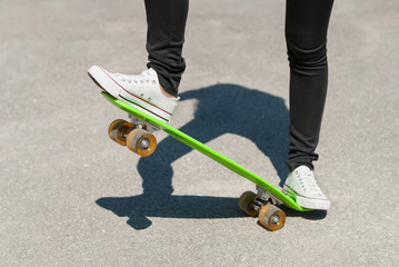 Skateboarder performing a trick on  skateboard.
