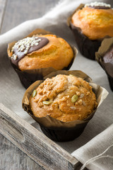Delicious muffins on a rustic tray

