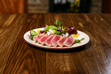 Beautiful meat dish on a wooden background