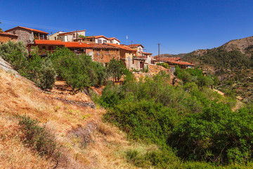 Fototapeta na wymiar Panoramic view near of Kato Lefkara - is the most famous village in the Troodos Mountains. Limassol district, Cyprus, Mediterranean Sea. Mountain landscape and sunny day.