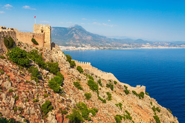 Beautiful sea landscape of Alanya Castle in Antalya district, Turkey, Asia. Famous tourist destination with high mountains. Summer bright day and sea shore