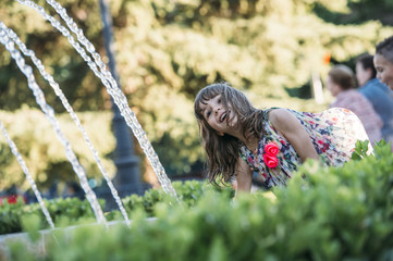 happy child playing in a fountain