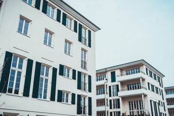 Row of coastal styled apartments with shutters