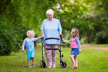 Grandmother with walker playing with two kids