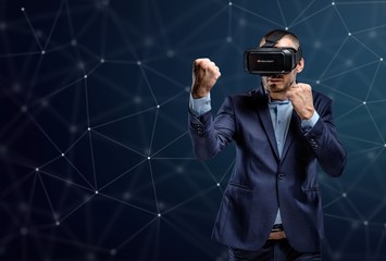 Fighter in a suit with virtual reality glasses device on his hea