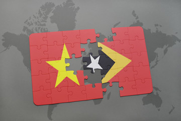 puzzle with the national flag of vietnam and east timor on a world map background.