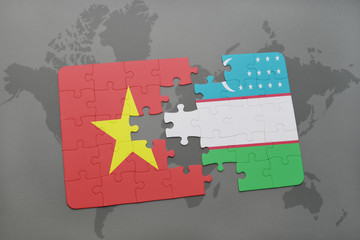 puzzle with the national flag of vietnam and uzbekistan on a world map background.