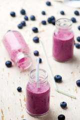 bilberry smoothie in glass small bottles
