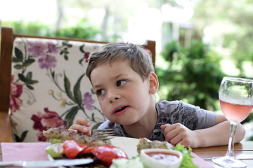 Kid eating kebab