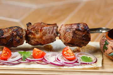 Beautiful meat dish on a wooden background