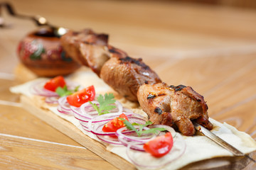Beautiful meat dish on a wooden background