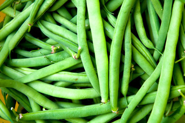 Fresh green beans on wooden table