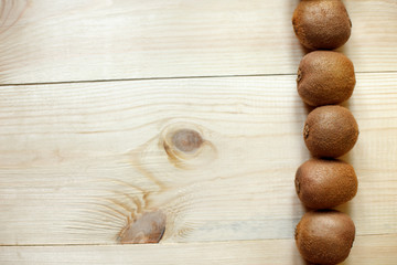 Fresh Kiwi Fruits on an old wooden table