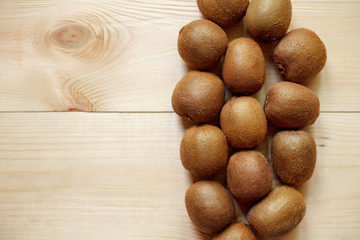 Fresh Kiwi Fruits on an old wooden table