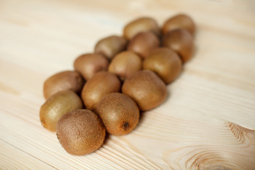 Fresh Kiwi Fruits on an old wooden table