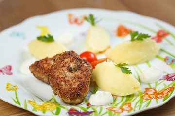 two patties with mashed potatoes