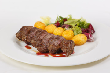 Roasted meat with vegetables on the table