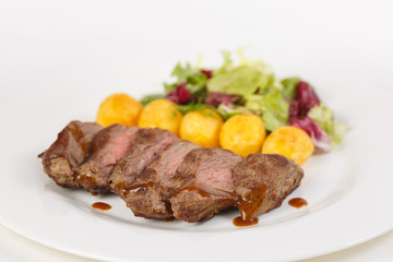 Roasted meat with vegetables on the table