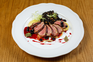 Beautiful meat dish on a wooden background