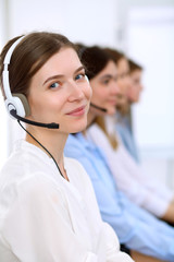 Call center operator.Young beautiful business woman in headset.