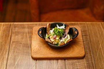 Beautiful meat dish on a wooden background