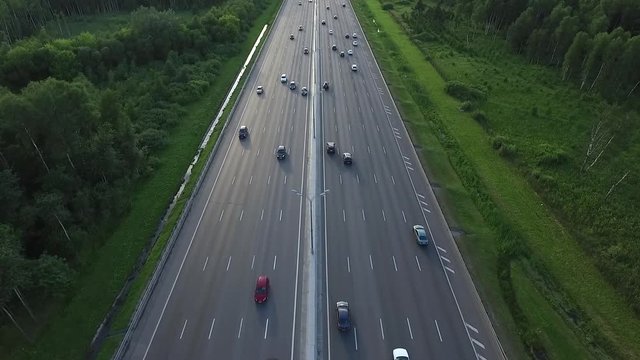 Aerial View of Traffic on a Motorway Ring Road Through a Wooded Area