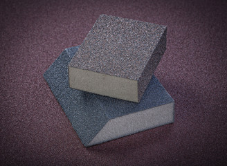 Abrasive sponges on polishing paper top view