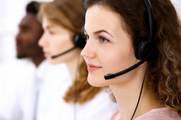 Call center operator.Young beautiful business woman in headset.