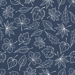 Autumnal leaves silhouettes seamless pattern