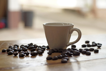 cup of coffee with coffee beans