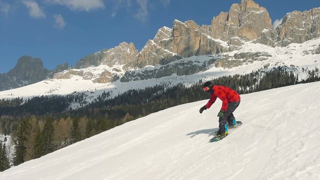 following snowboarder jumping flipping into air slow motion