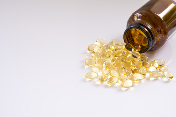 Omega 3 fish oil capsules on a white background