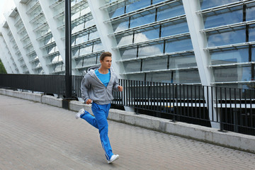 Young man running on the street