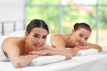 Obraz na płótnie Canvas Beautiful girls relaxing in spa salon