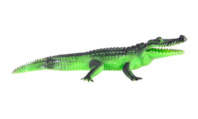 Plastic crocodile toy crawling isolated on white background.Plas