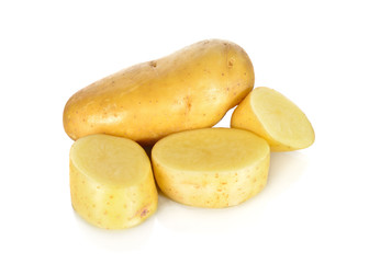whole and sliced uncooked fresh potato on white background