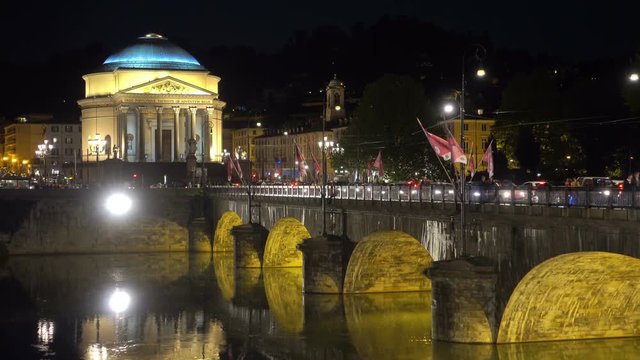 establishing shot of turin city at night vittorio emanuele bridge and gran madre di dio church