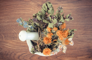 Vintage photo, Dried herbs and flowers in white mortar, herbalism, decoration