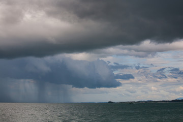 Rain storms are happening at sea.