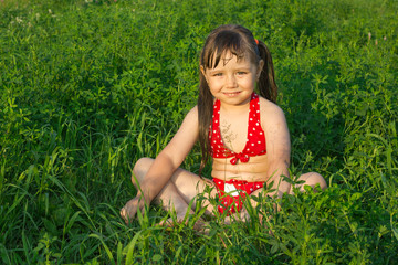 little white girl children sit on grass