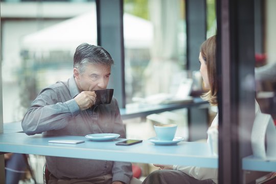 Man and woman having coffee