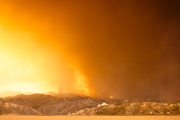 Wildfire in the mountains near freeway