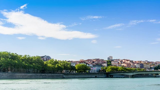 Timelapse 4k of the cityscape of town on the hill Croix-Rousse, Lyon, France with the rhone river foreground and the movement of cloud..
