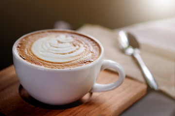 Hot coffee on a wooden table.