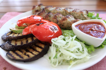White plate with kebab