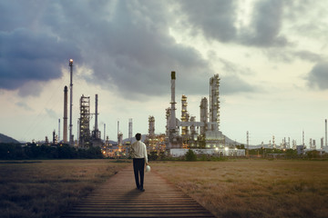 Fototapeta na wymiar Engineer standing at oil refinery