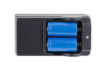 Closeup of blue W 16340 Li thium battery,1200 mAh 3.7 V Li-ion with its black charger isolated on...